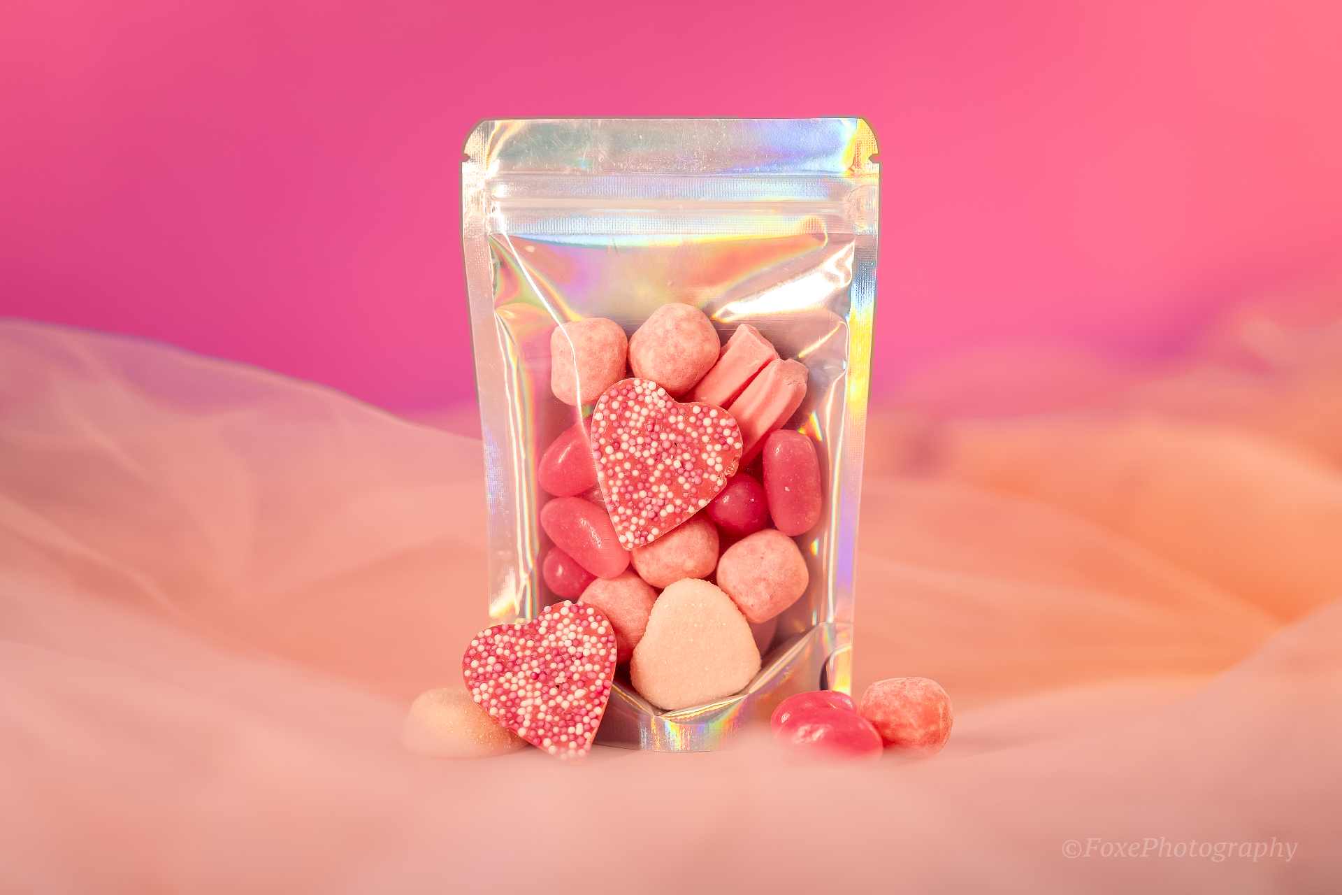 A generous lolly platter box filled with assorted colourful sweets, gummy lollies, chocolates and candy